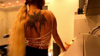 Hot tattooed blonde long hair beauty in the kitchen takes her panties off to show her meaty pussy an