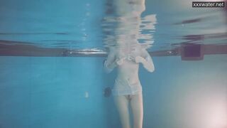 Sasha goes naked into the pool